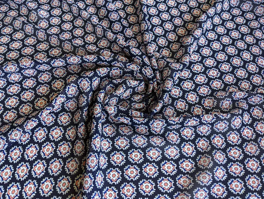 Шифон креповий квіткова геометрія, персиковий на темно-синьому - фото 1 - інтернет-магазин tkani-atlas.com.ua