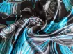 Атлас стрейчевый яркие узоры, бирюзово-серый на черном - интернет-магазин tkani-atlas.com.ua