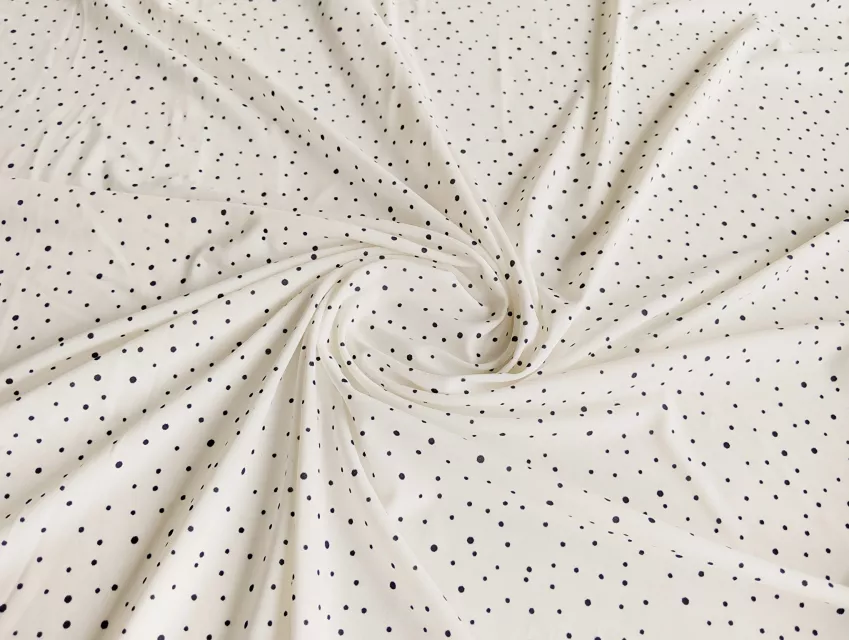 Трикотаж масло розсип горошків, чорний на молочному - фото 1 - інтернет-магазин tkani-atlas.com.ua