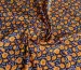 Штапель Бельмондо цветочное плетение, оранжевый на темно-синем - фото 1 - интернет-магазин tkani-atlas.com.ua