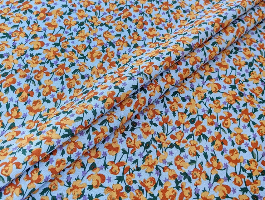 Котон весняна галявина, помаранчевий на блакитному - фото 1 - інтернет-магазин tkani-atlas.com.ua