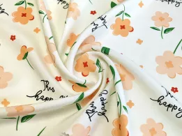 Штапель квітковий з написами, кремовий - інтернет-магазин tkani-atlas.com.ua