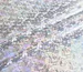 Трикотаж масло нарядное голограмма радужная, серебро на белом - фото 1 - интернет-магазин tkani-atlas.com.ua